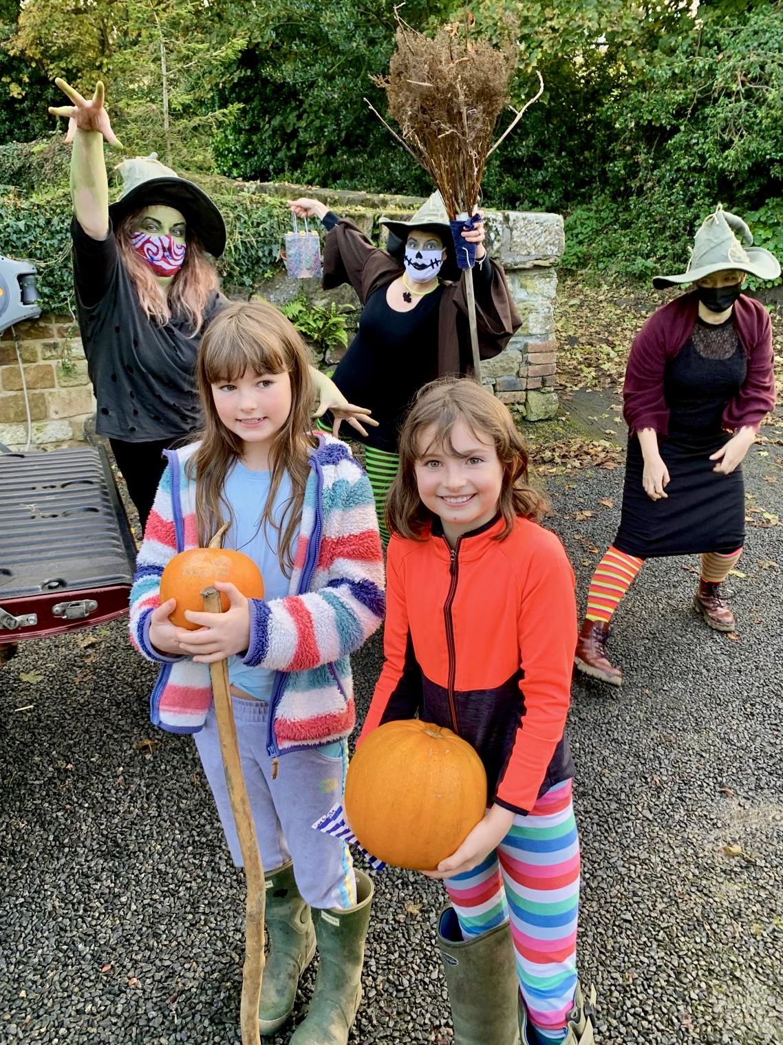 Farmily members with pumpkins